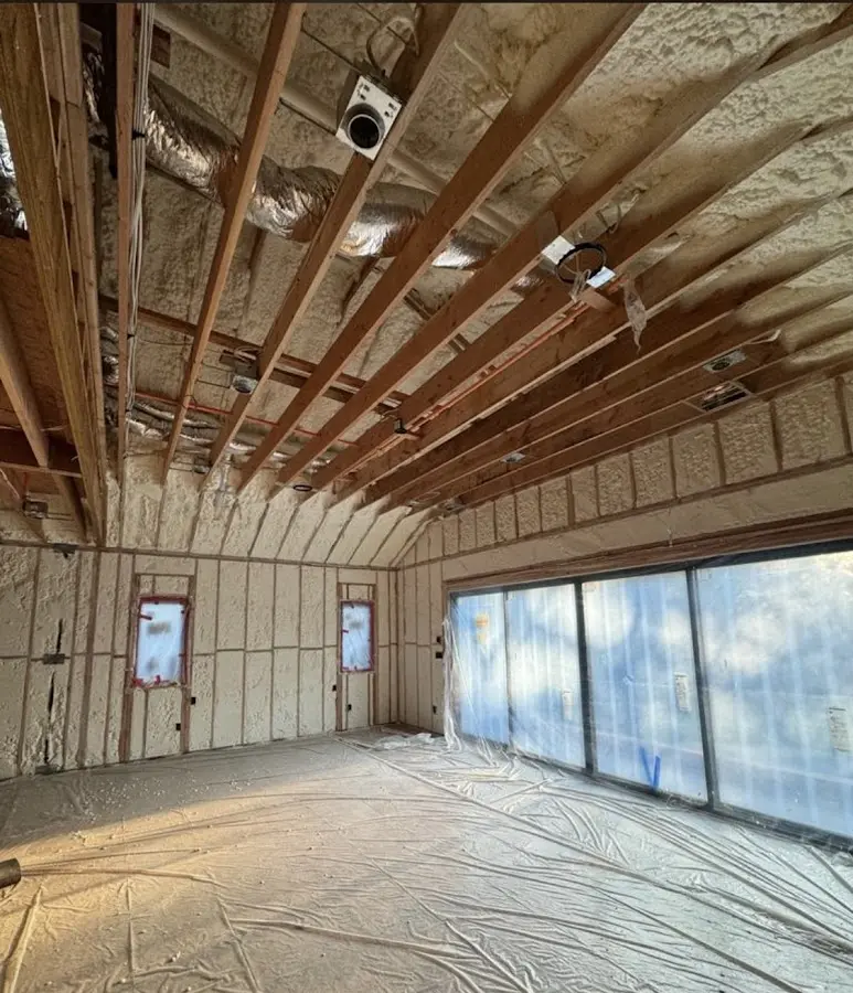 Interior walls and ceiling insulated with spray foam during new construction in Seward